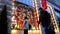 Lviv, Ukraine - December 27, 2021: woman walking by dusk city street stop to look at signboard store window