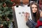 Lviv, Ukraine - January 2, 2020: Street Artist Draws Sketch Portrait of a beautiful girl