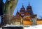 LVIV, UKRAINE - January 31, 2021: Old wooden retro church in the Shevchenko Grove Old village in winter and at night