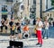 Lviv, Ukraine - July 2015: Musicians playing the saxophone, drums and guitar giving a concert in the Market Square in Lviv before