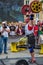 LVIV, UKRAINE - JULY 2016: Strong athlete bodybuilder pumped strongman with a heavy body raises the bar in front of a pack of