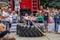 LVIV, UKRAINE - JULY 2016: Strong athlete strongman pulling a rope truck sitting with a partner is not huge tires