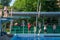 LVIV, UKRAINE - JUNE 2016: Young children are trained in the tower diving in the pool