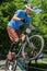 LVIV, UKRAINE - JUNE 2018: A cyclist performs tricks on a bicycle trial to overcome an obstacle course