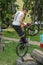 LVIV, UKRAINE - JUNE 2018: A cyclist performs tricks on a bicycle trial to overcome an obstacle course