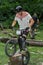 LVIV, UKRAINE - JUNE 2018: A cyclist performs tricks on a bicycle trial to overcome an obstacle course