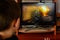 LVIV, UKRAINE - MARCH 08, 2019: Illustration of a computer game World of Tanks, showing a teenager playing this game