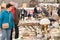 Lviv, Ukraine - May 1, 2022 : people bying different antiques on flea market Vernisazh