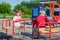 LVIV, UKRAINE - MAY 2017: Children boy and girl ride on a swing on a bright sunny day