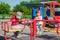 LVIV, UKRAINE - MAY 2017: Children boy and girl ride on a swing on a bright sunny day