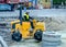 Lviv, Ukraine - September 2015: Tractor rams sand on the road reconstruction on Liberty Avenue in Lviv