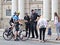 Lviv, Ukraine - spt 08 2018: New police helps people in the city center near the opera house. A bicycle patrol communicates with c