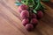 Lychee with leaves on a wooden board