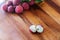 Lychee with leaves on a wooden board