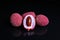 Lychee or litchi litchies or lychees on black reflective studio background. Isolated black shiny mirror mirrored background for ev