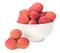 Lychees fruits in bowl isolated