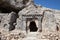 Lycian rock tombs over blue sky at location Tlos Ancient City, Turkey