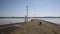 Lydney harbour jetty view across the River Severn estuary towards Berkely and Sharpness Gloucestershire uk pan