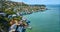 Lyford Cove with aerial Tiburon city with houses against shoreline and up hilly cliff