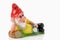 Lying garden gnome holding flower