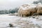 lying pieces of ice on the seashore, icicles of different sizes, textures of sand and ice in the dunes