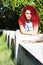 Lying red curly hair styled teen