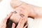 Lymphatic drainage face massage closeup view by professional massage therapist