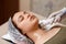 Lymphatic drainage massage LPG apparatus process. Therapist beautician makes a rejuvenating facial massage for the woman