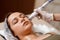 Lymphatic drainage massage LPG apparatus process. Therapist beautician makes a rejuvenating facial massage for the woman