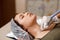 Lymphatic drainage massage LPG apparatus process. Therapist beautician makes a rejuvenating facial massage for the woman