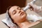 Lymphatic drainage massage LPG apparatus process. Therapist beautician makes a rejuvenating facial massage for the woman