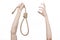 Lynching and suicide theme: man\'s hand holding a loop of rope for hanging on white isolated background