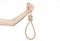 Lynching and suicide theme: man\'s hand holding a loop of rope for hanging on white isolated background