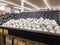 Lynnwood, WA USA - circa April 2022: Angled view of bulbs of garlic in the produce section of a Safeway grocery store