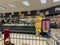 Lynnwood, WA USA - circa October 2022: Wide view of people shopping for Butterball Thanksgiving turkeys inside a QFC grocery store