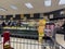 Lynnwood, WA USA - circa October 2022: Wide view of people shopping for Butterball Thanksgiving turkeys inside a QFC grocery store