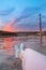 Lyon city at sunset with red footbridge leading to Courthouse Palais de Justice over Saone river