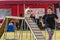 LYSA NAD LABEM, CZECH REPUBLIC - SEPTEMBER 26, 2021: Dog and a handler running over dog walk during agility competition