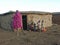 Maasai family standing in the yard of the Masai tribe village house, Jan 6, 2004 in Masai Mara,
