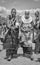 Maasai ladies collecting cow dung to use for house repair