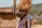 Maasai man, warrior, male lion mane on head, spear in hand, Tanzania