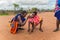 Maasai men make fire in the traditional way