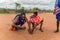 Maasai men make fire in the traditional way