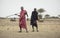 Maasai men practicing throwing a spear