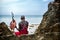 Maasai sitting by the ocean