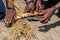 Maasai tribesman demonstrating fire making at village by using friction in Arusha, Tanzania, Africa