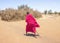 Maasai walking away towards homestead