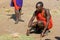 Maasai warrior makes open fire in the bush.