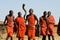 Maasai warrior perform dance in their traditional clothes and jewelry.