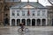 Maastricht, Limburg, The Netherlands - Cyclist passing the facade of the former Civil Guard Headquarters at the Vrijthof square